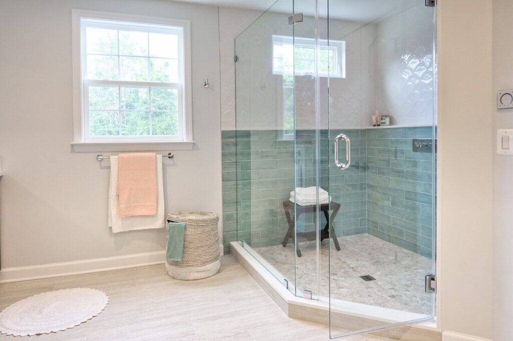 frameless glass shower door in small bathroom